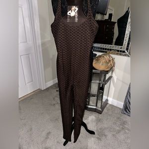 NWT. Naked Wardrobe sleeveless catsuit w/racer back.